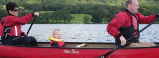 Mum and dad take control canoeing on Coniston Water Lake District.  Canoeing is the perfect family activity to get everyone canoeing on the water.  Canoes are great for going on journies and younger canoeists don't need to paddle as much as the grown ups.